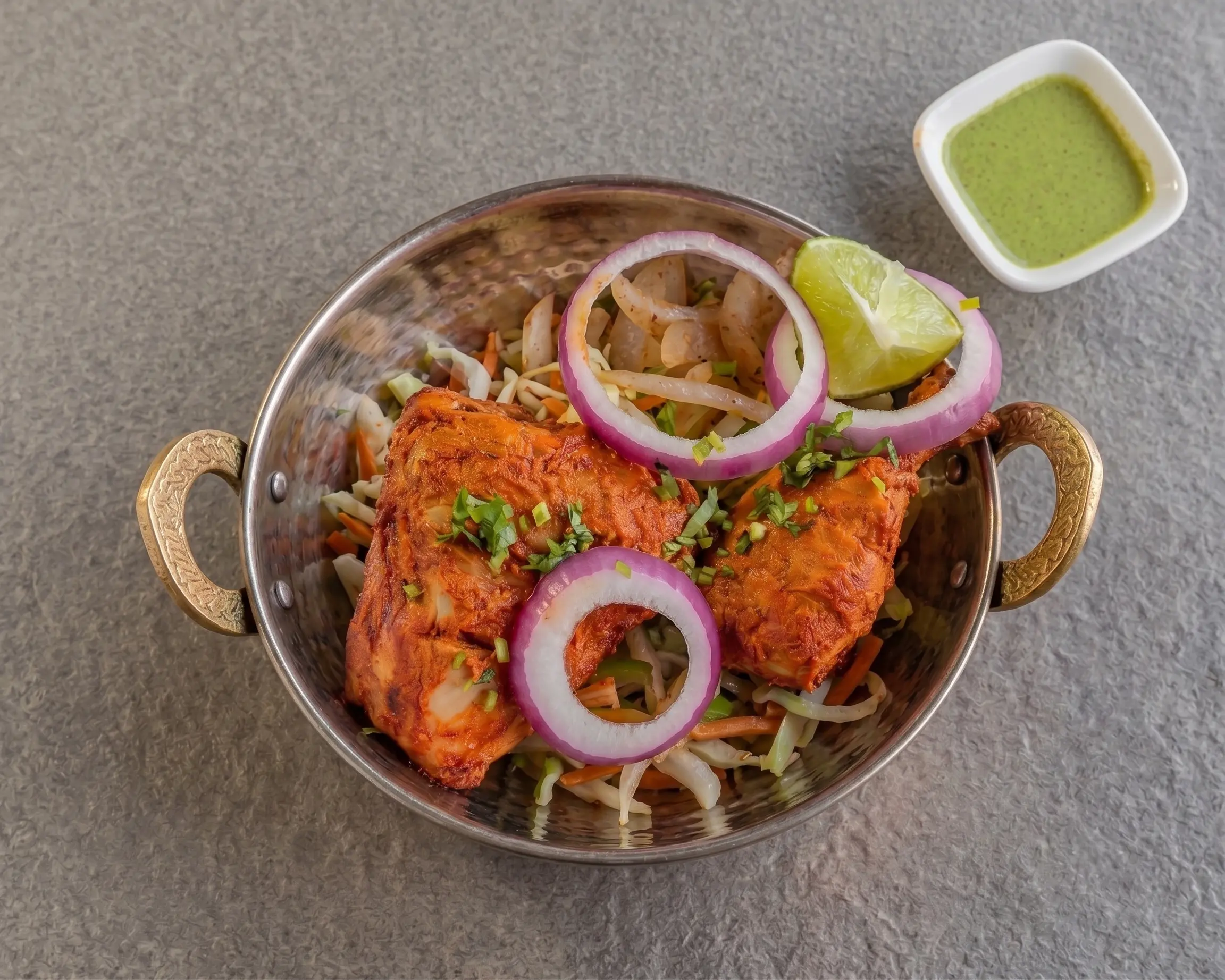 Tandoori chicken with onion, lime and mint chutney at Haandi Indian Cuisine, Calgary