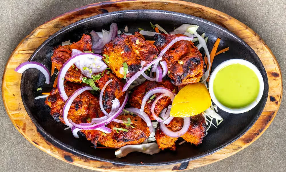 Chicken Tikka &mdash; boneless tandoor-grilled chicken with red onion, lemon and mint sauce at Haandi Indian Cuisine in Bowness, Calgary